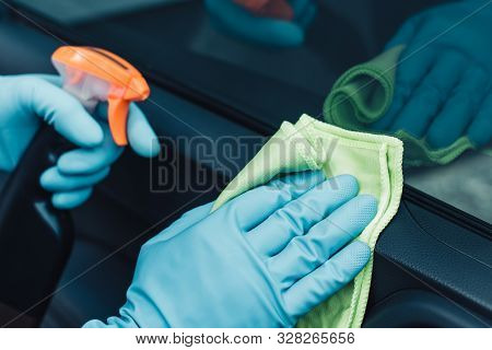 Partial View Of Car Cleaner In Rubber Gloves Cleaning Car With Rag