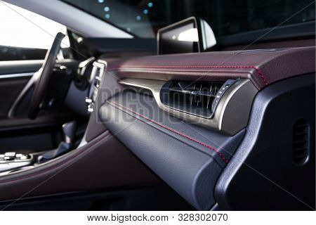 Luxury Car Inside. Interior Of Prestige Modern Car. Comfortable Leather Seats. Rred Perforarated Lea