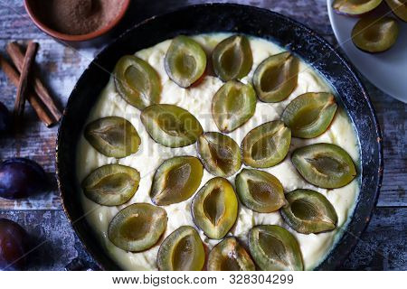 Making Plum Pie With Sugar And Cinnamon. American Plum Pie.