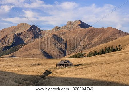 Mountain Landscape In Fagaras Mountains, Romania. In The Background Lespezi Peak 2517m And Negoiu Pe