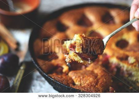 Selective Focus. Slice Of Plum Pie On A Fork. Homemade American Plum Pie. Macro.