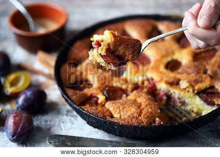 Selective Focus. Slice Of Plum Pie On A Fork. Homemade American Plum Pie. Macro.