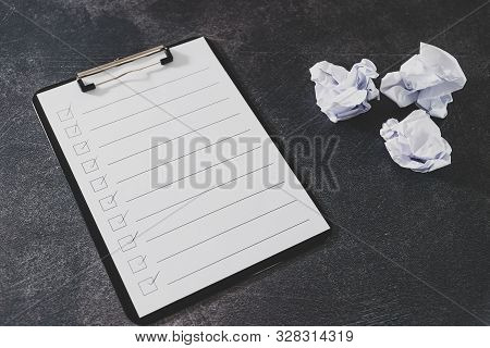 Overcoming Lack Of Productivity Concept, To Do List On Clipboard And Pencil Next To Scrunched Papers