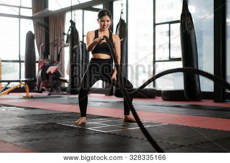 Beautiful Asian Woman With Balck Battle Rope Battle Ropes Exercise In The Fitness Gym With Boxing Ba