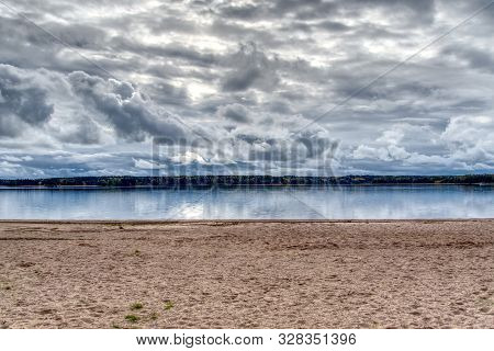 Beautiful Cloudscape Over The Sea From Sandy Beach. Baltic Sea Hdr