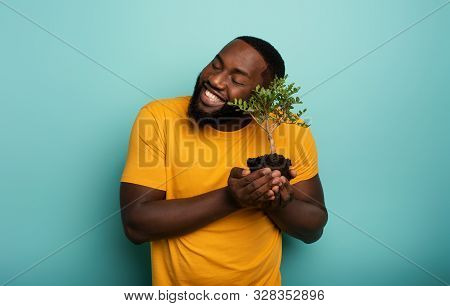 Happy Boy Loves A Small Tree Ready To Be Planted. Concept Of Forestation