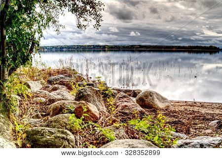 Pleasant Landscape, Nature, Sea View. The Sky In Thick Rain Clouds, The Rocky Shore And The Baltic S