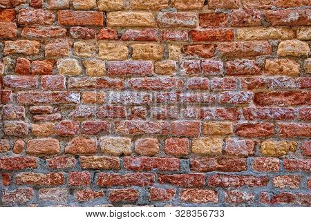 Red Brick Wall With Saltpeter And Moisture In Venice.