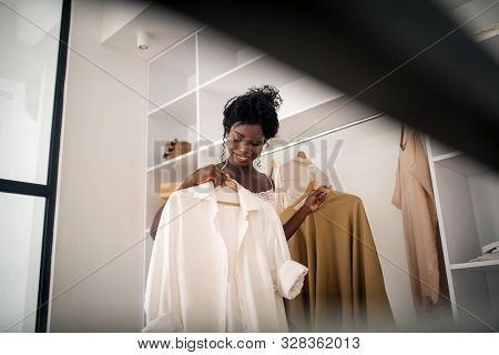 Woman Feeling Excited In The Morning While Choosing Clothing