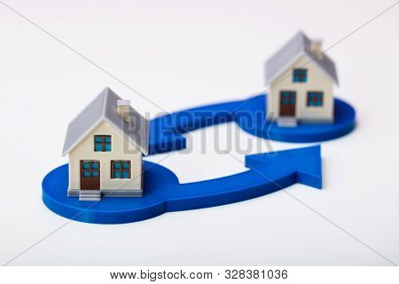 Two Houses And Arrows In House Swapping Concept