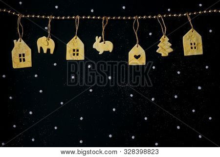 Beautiful Christmas Decoration With Handemade Toys On Black Snowfall Background. Flat Lay Design. Co