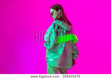 Young Stylish Girl Dancing In The Studio On A Colored Neon Background. Music Poster Design.