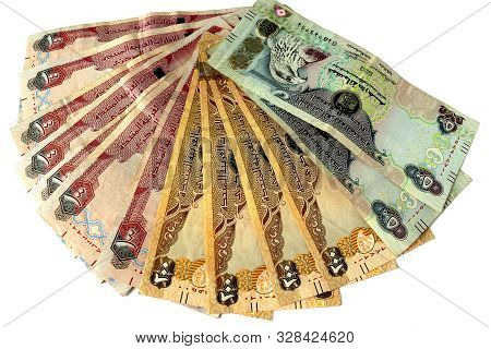 Uae National Currency, Top View Of Dirhams Banknotes On White Background. Dirhams