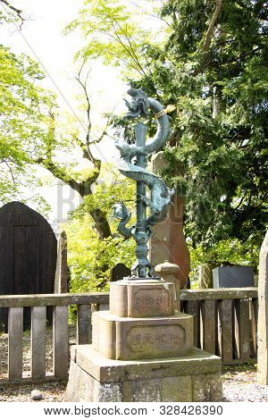 Narita, Japan - May 3, 2019 Stone Statue Of Sword And Dragon In Naritasan Shinshoji Temple. This Tem