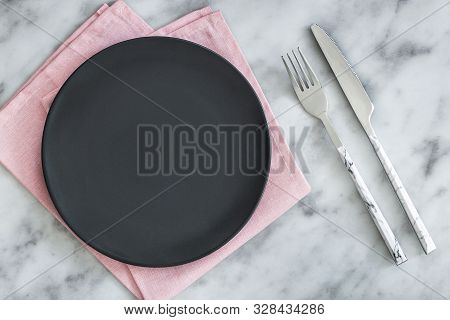 Empty Black Slate Plate On Grey Stone Table And Napkin. Food Background For Menu, Recipe. Table Sett
