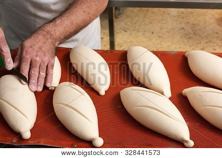 Cut Into The Bread Of The Already Fermented Bread Before It Goes Into The Oven