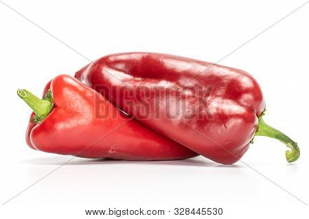 Group Of Two Whole Sweet Red Bell Pepper Isolated On White Background