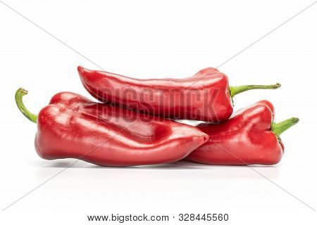 Group Of Three Whole Sweet Red Bell Pepper Isolated On White Background