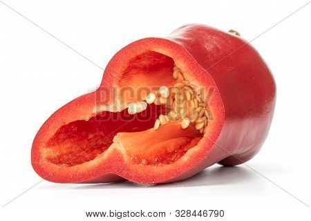 One Half Of Sweet Red Bell Pepper With Seeds Isolated On White Background