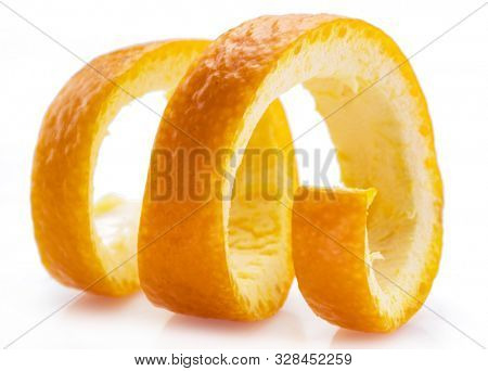 Orange peel or orange twist on white background. Close-up.
