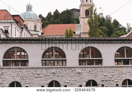 Architecture Of Slovenia. Historic Streets During The Day Along The Canal. Travel Photo. Free Space 