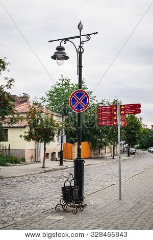 Lutsk, Ukraine - July 3, 2018: Carved Metal Lantern In The Old Style And Sights Pointer In Historica
