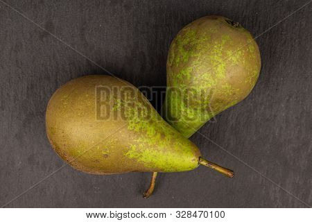 Group Of Two Whole Fresh Green Pear Flatlay On Grey Stone