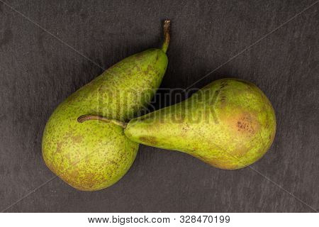 Group Of Two Whole Fresh Green Pear Flatlay On Grey Stone