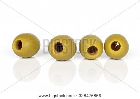 Group Of Four Whole Marinated Green Olive Isolated On White Background