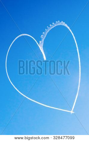 Romantic Heart Written In The Blue Sky By A Small Aircraft