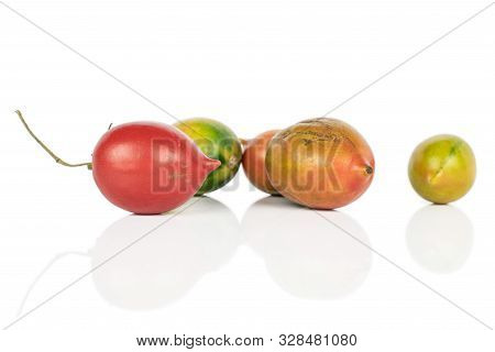 Group Of Five Whole Fresh Tomato De Barao Isolated On White Background