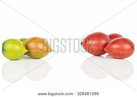 Group Of Six Whole Fresh Tomato De Barao Isolated On White Background