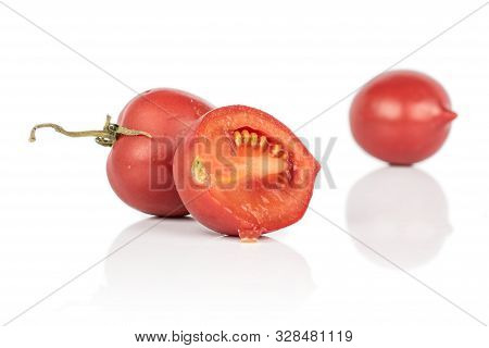 Group Of Two Whole One Half Of Fresh Tomato De Barao Isolated On White Background