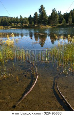 Sundown Brings Refletions On The Water Of Spooner Lake In Lake Tahoe
