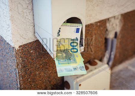 Hundredth Euro Banknotes In Drainpipe. Money Or Business Concept. Abstract Conceptual Image