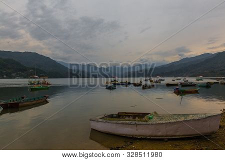 Colorful Boats In Fewa Lake After The Storm In Pokhara, Nepal