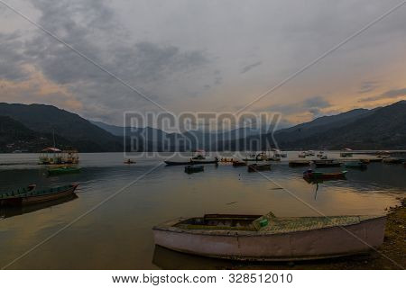 Colorful Boats In Fewa Lake After The Storm In Pokhara, Nepal