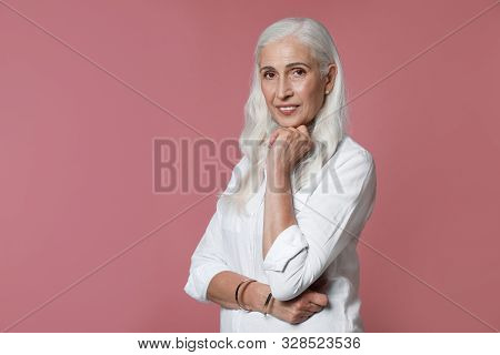 Portrait Of Beautiful Mature Woman On Pink Background, Space For Text