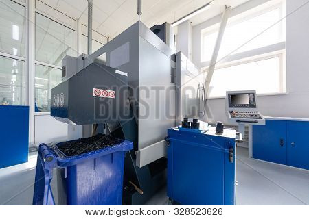 Equipment For Cutting Metal And Containers Filled With Swarf. Photo With Depth Of Field