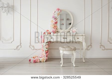 Vintage Style Boudoir Table With Round Mirror And Flowers. White Bright Room.