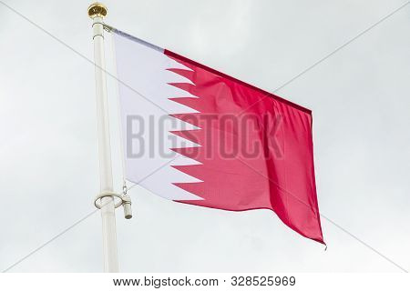 Katar Flag Waving In The Wind Against Sky