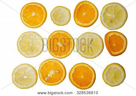 Slices Of Lemons And Oranges Are Isolated