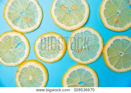 Slices Of Lemons On A Blue Background