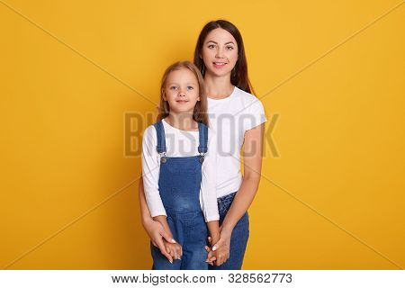 Horizontal Shot Of Mother With Daughter, Being Happy Spending Together, Female Dresses White T Shirt