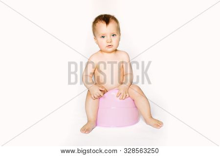 Smiling Baby On Chamber-pot. Isolated On White Background