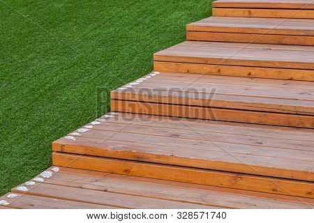 Light Color Wooden Steps Near Green Lawn Outdoors