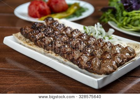 Fast Food. Eastern Food. Shish Kebab, Lyulya-kebab. Dishes Of Oriental Cuisine Lying In Plte And Dec