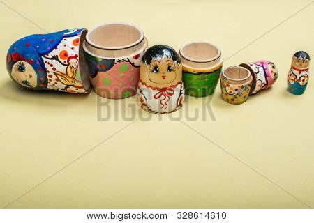 Russian Traditional Matrioshka  On Yellow Background In The View