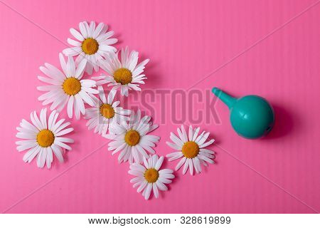 Green Douche Enema Bowel Washing, Rinse Mouth, Nose Top View On A Pink Background