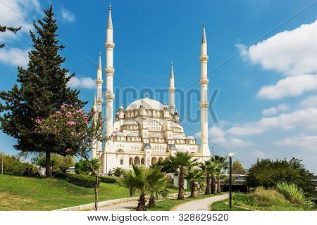 Turkeys Largest Sabanci Central Mosque In Adana, Illuminated By The Sun, Against A Blue Sky, Bloomin